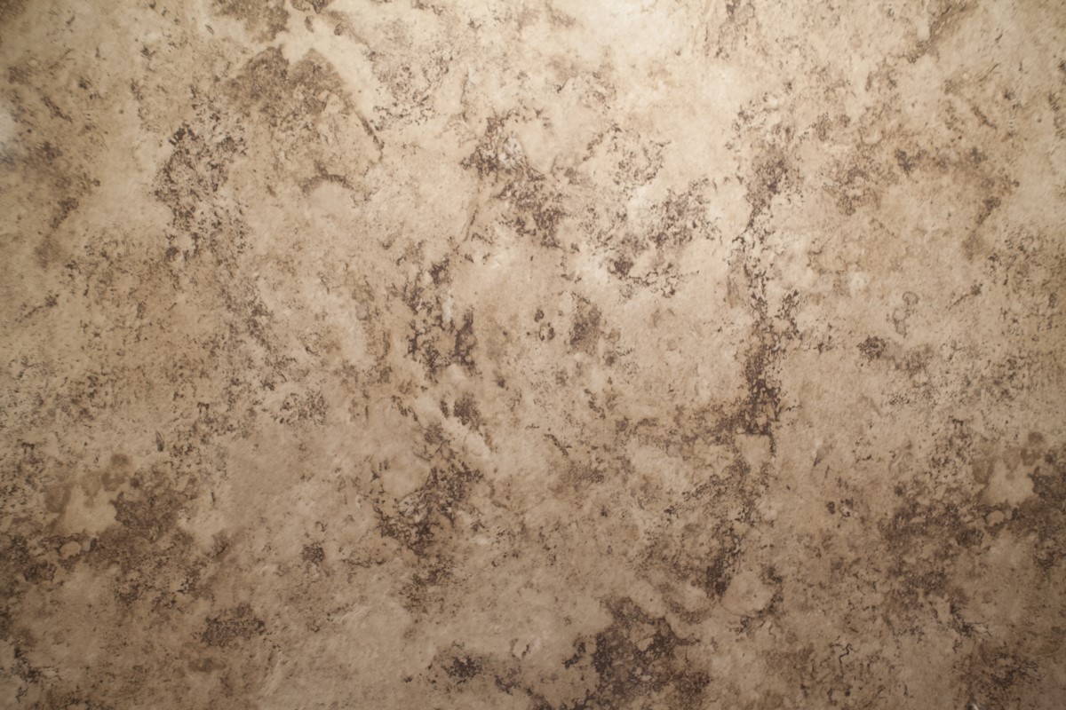 closeup of shower color/texture named "Madeira Granite"